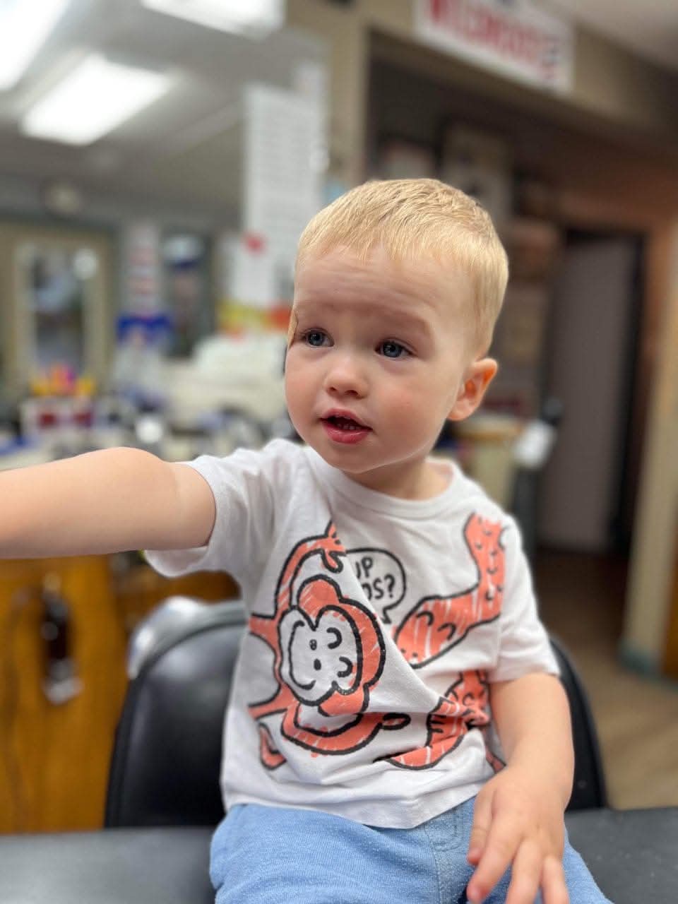 Happy toddler after first haircut