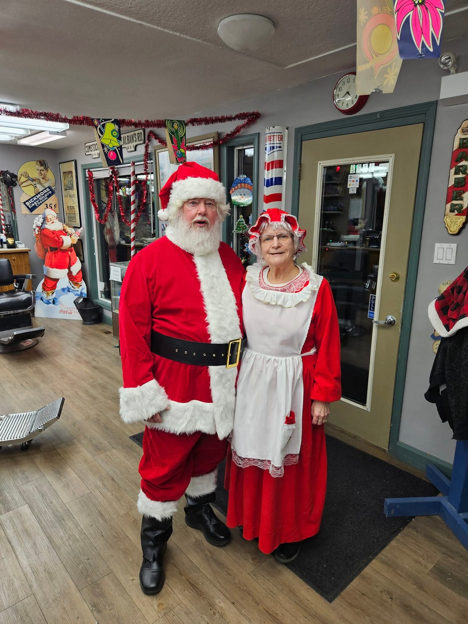 Santa and Mrs. Claus visiting Valleyview Barbers